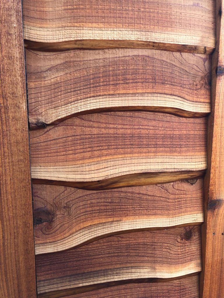 Close-up of tree house live edge siding